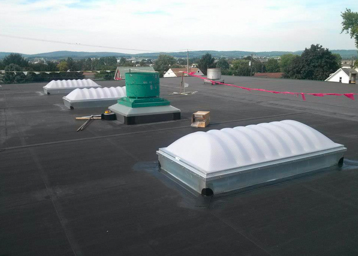 EPDM roof with new skylights and exhaust curb flashings