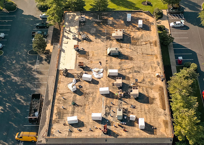 Aerial view of a large black commercial roof