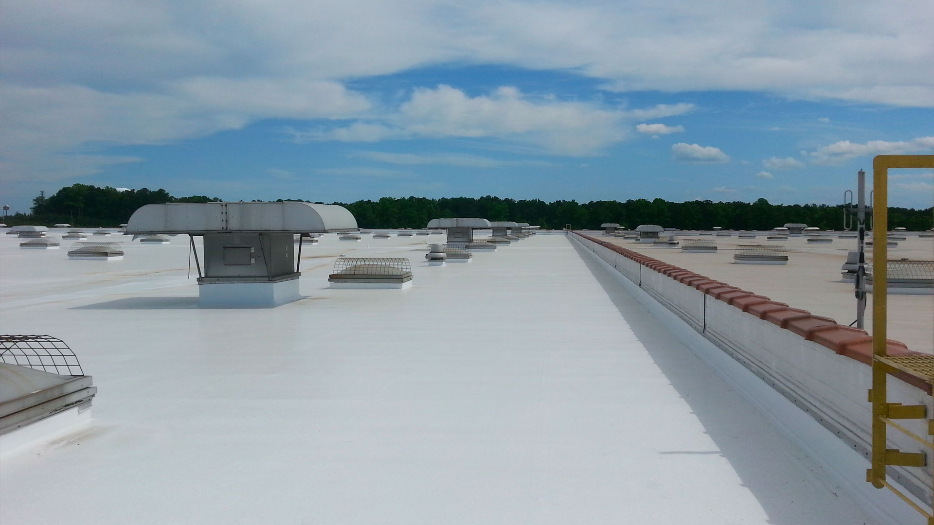 Large white single-ply commercial roof, evaluated and documented by Sensenig